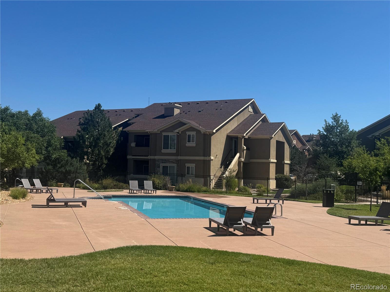 4730 Copeland Circle, Unit 101 Highlands Ranch, CO 80126 - Photo 11 of 14 a view of a house with sitting area and furniture