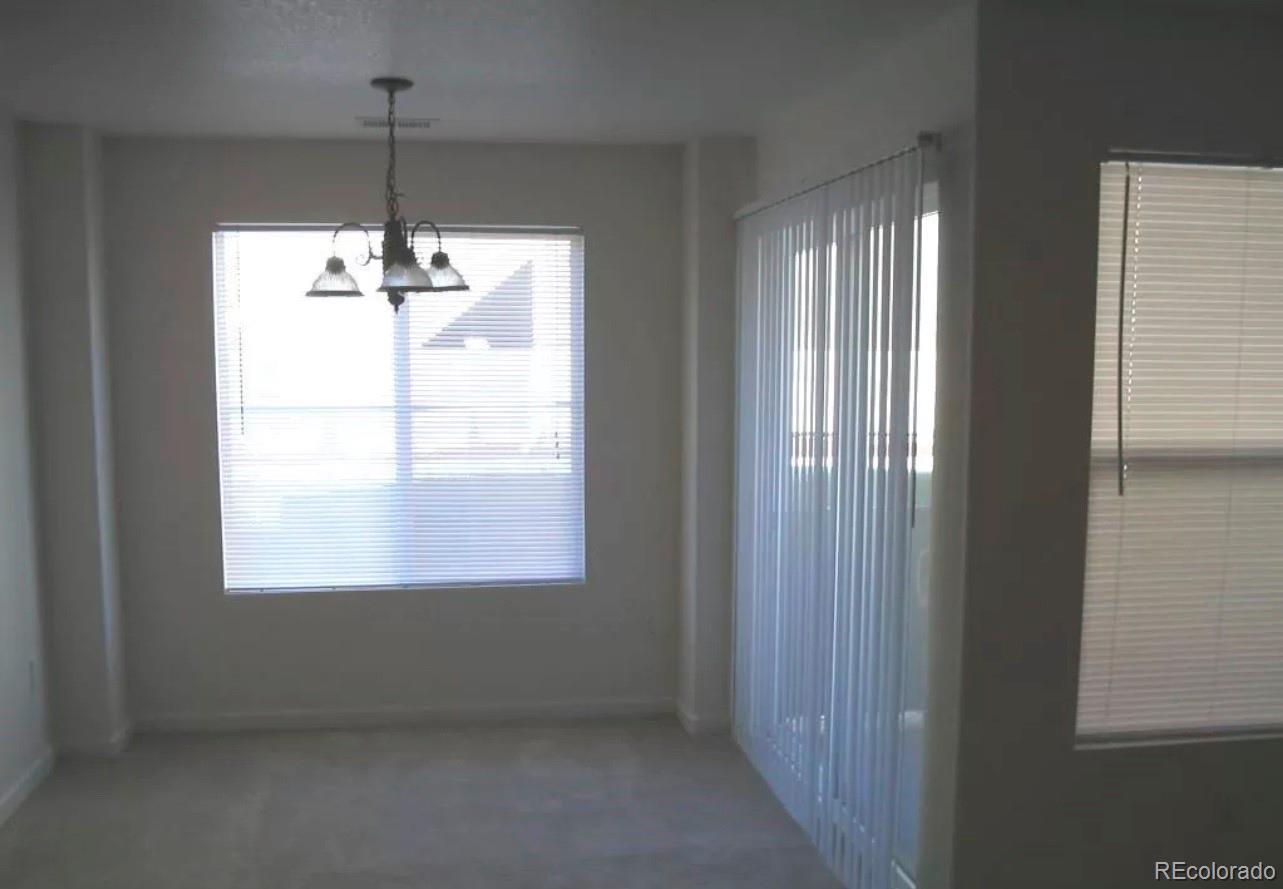4730 Copeland Circle, Unit 101 Highlands Ranch, CO 80126 - Photo 2 of 14 a view of an empty room with a window