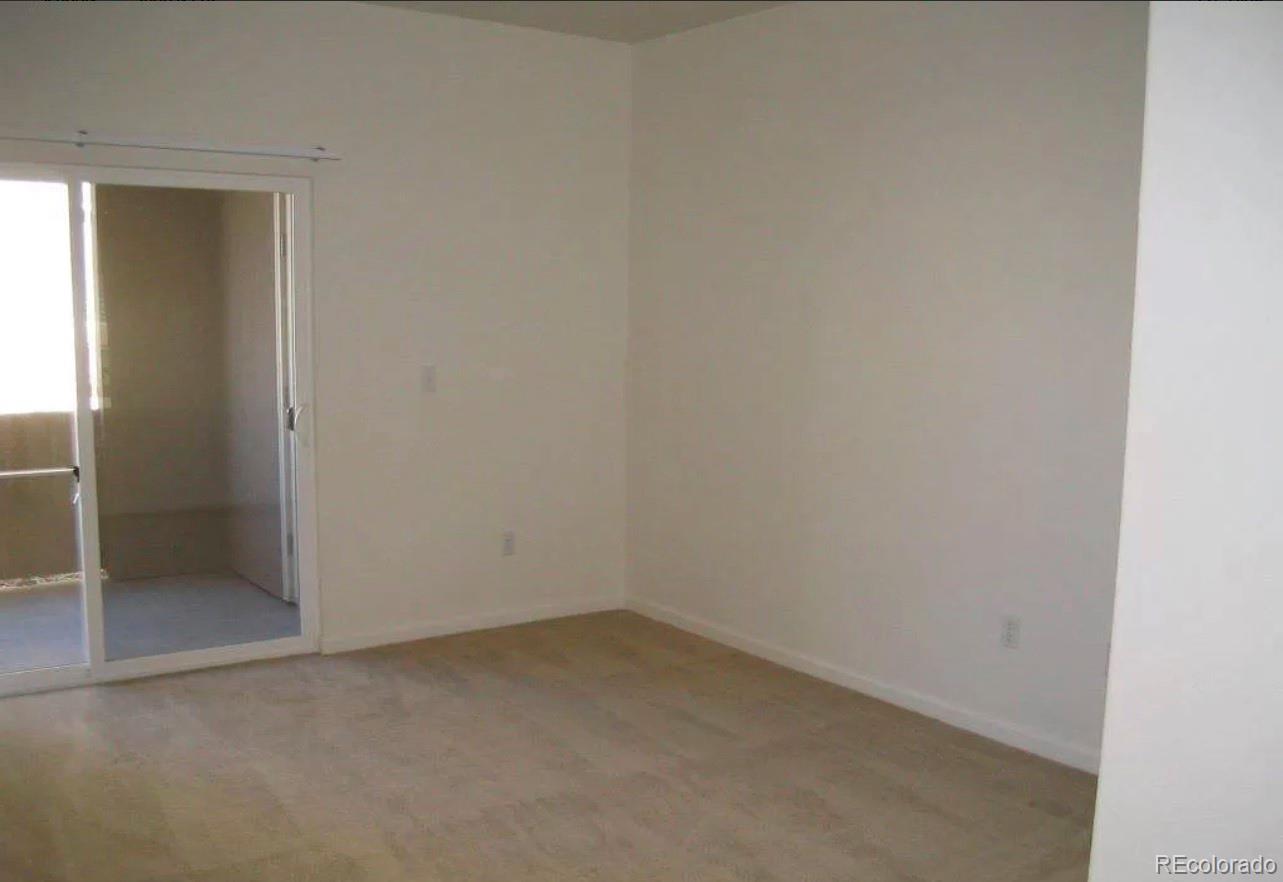 4730 Copeland Circle, Unit 101 Highlands Ranch, CO 80126 - Photo 3 of 14 an empty room with a bathroom