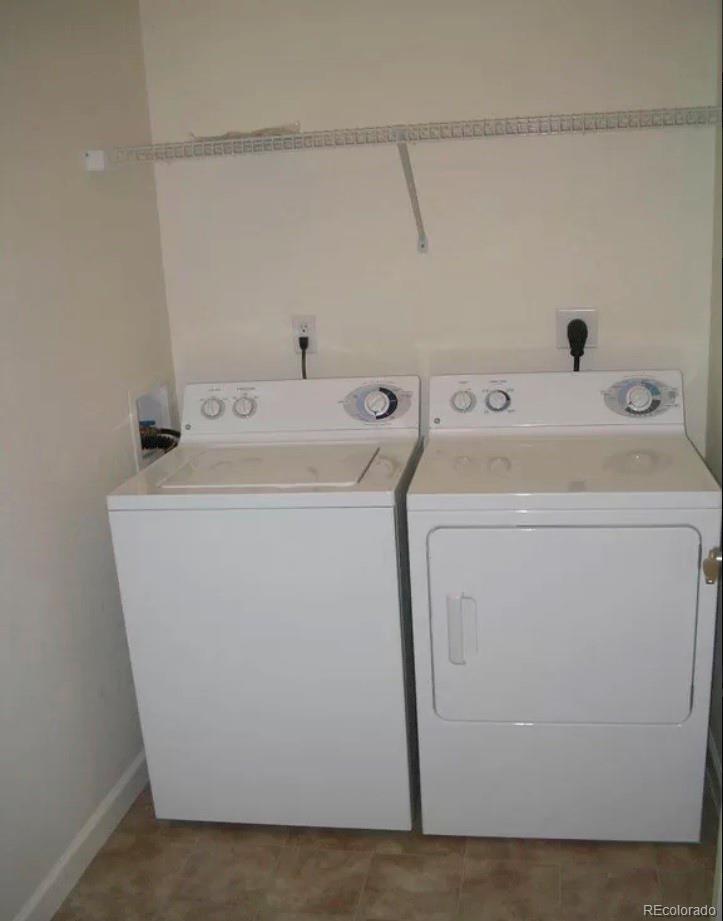 4730 Copeland Circle, Unit 101 Highlands Ranch, CO 80126 - Photo 9 of 14 a utility room with dryer and washer