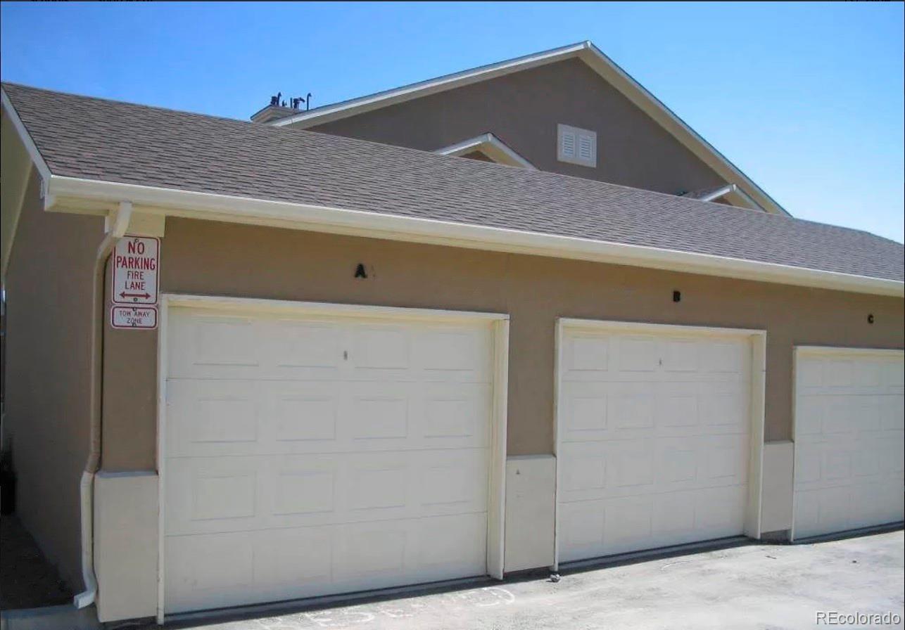 4730 Copeland Circle, Unit 101 Highlands Ranch, CO 80126 - Photo 10 of 14 a front view of a house