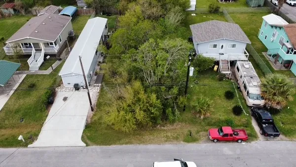 an aerial view of houses with outdoor space