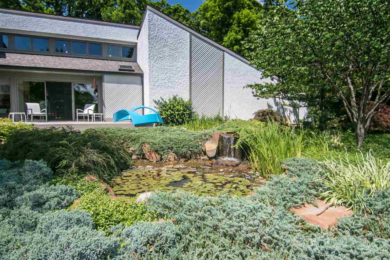 600 Riverside Road Belvidere, IL 61008 - Photo 19 of 25 a view of a house with a small yard and plants