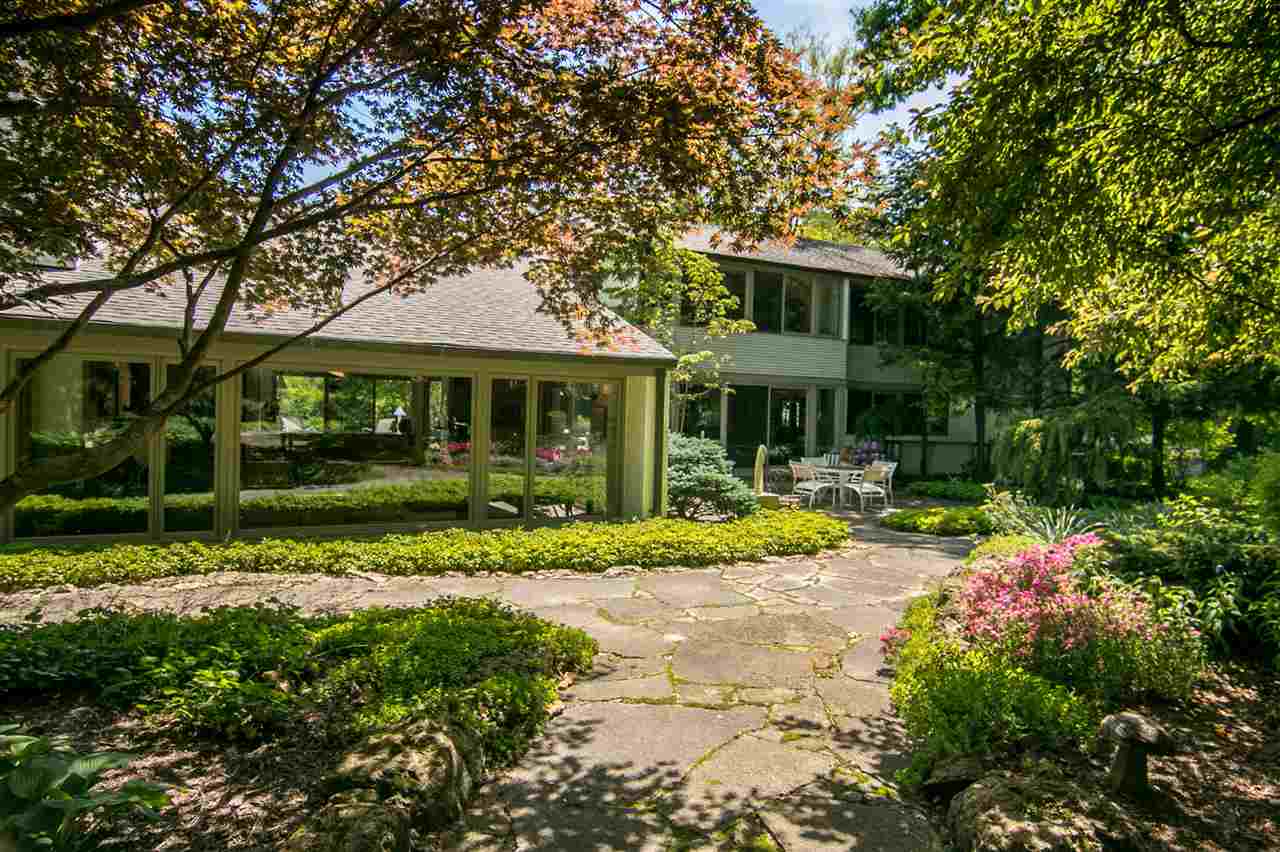 600 Riverside Road Belvidere, IL 61008 - Photo 20 of 25 a front view of a house with a yard table and chairs