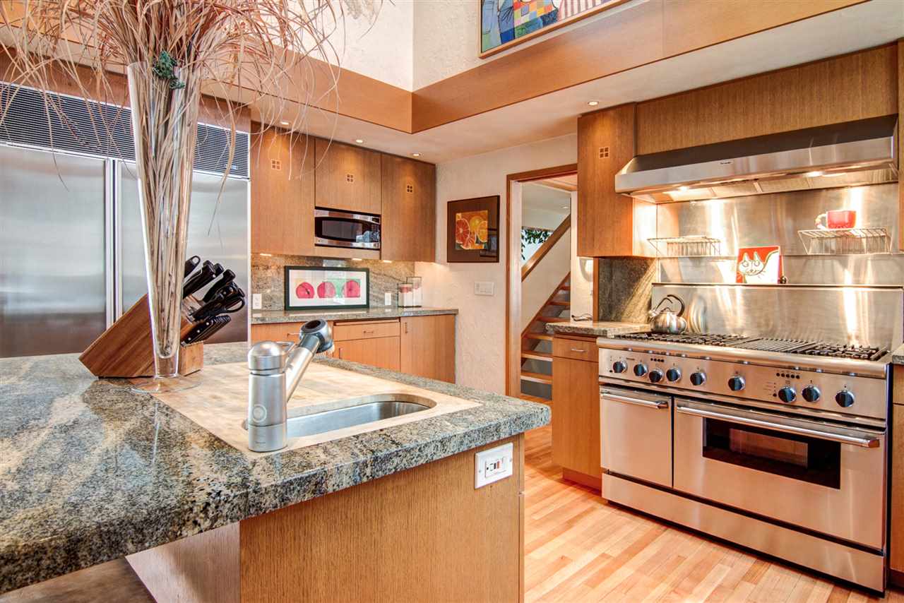 600 Riverside Road Belvidere, IL 61008 - Photo 5 of 25 a kitchen with stainless steel appliances granite countertop a stove and a sink