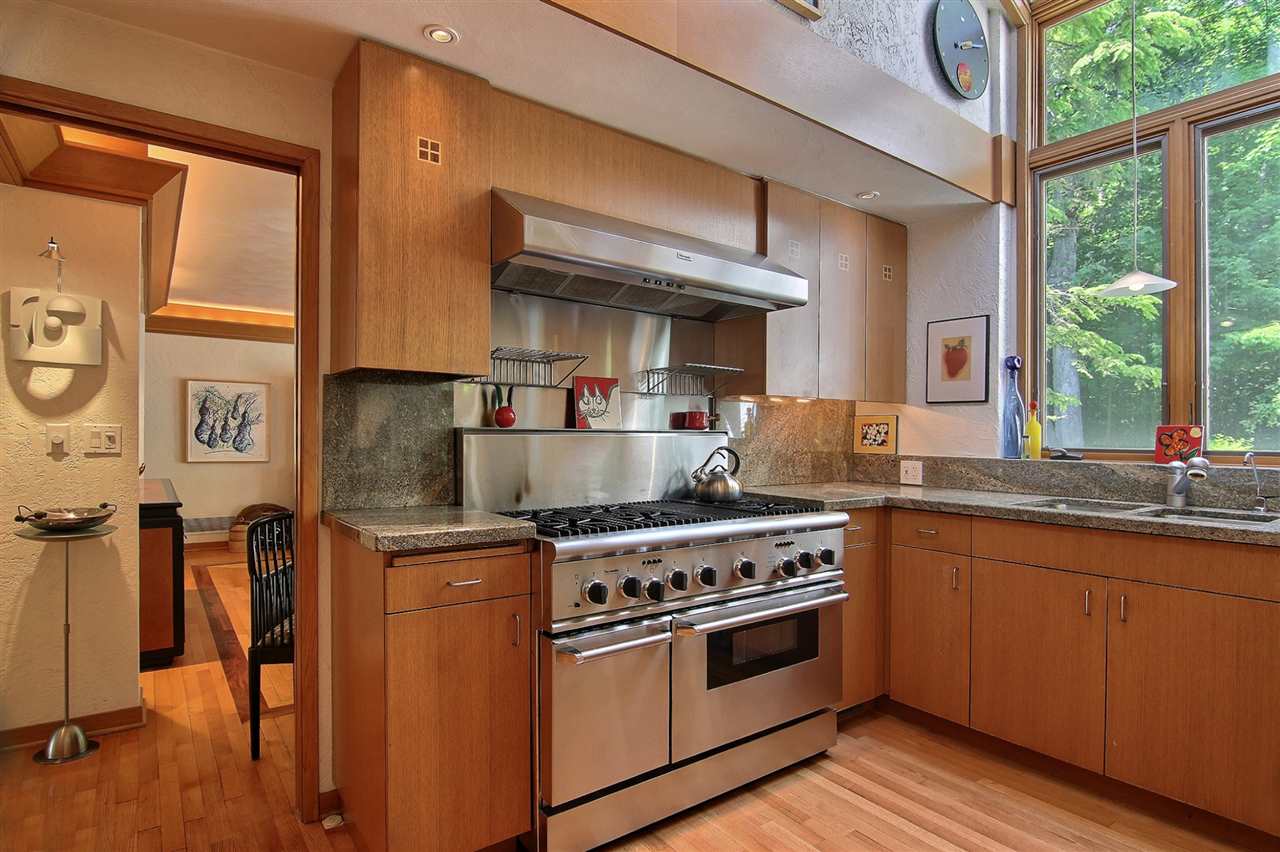 600 Riverside Road Belvidere, IL 61008 - Photo 6 of 25 a kitchen with stainless steel appliances granite countertop a stove and a sink