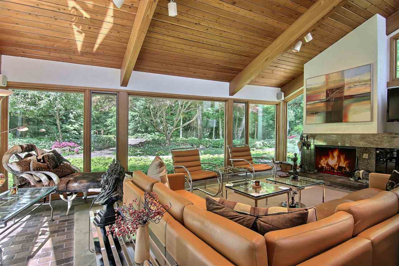 600 Riverside Road Belvidere, IL 61008 - Photo 9 of 25 a living room with furniture a fireplace and floor to ceiling windows