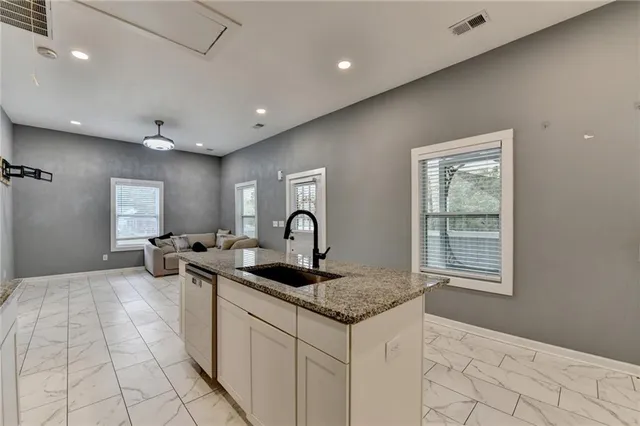 a view of a livingroom with a ceiling fan and window