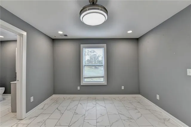 a view of an empty room with a window