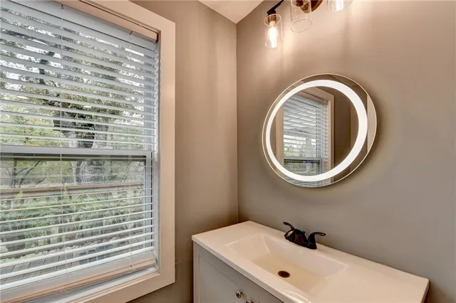 a view of a wooden deck with a yard