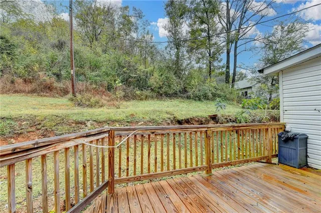 a view of a balcony with wooden floor