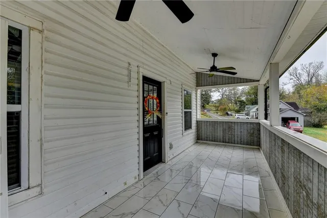a living room with a couch and a window