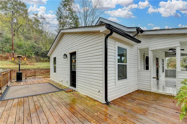 a view of a wooden deck with a yard