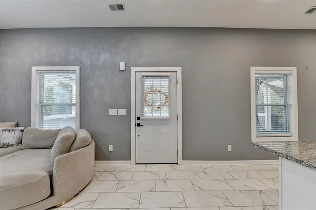 a living room with furniture and window