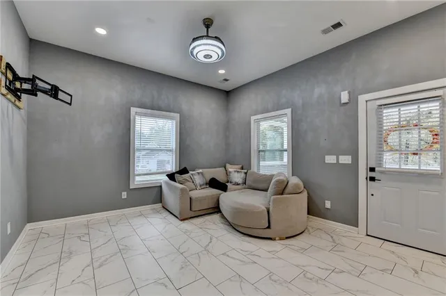 a bedroom with furniture and a window