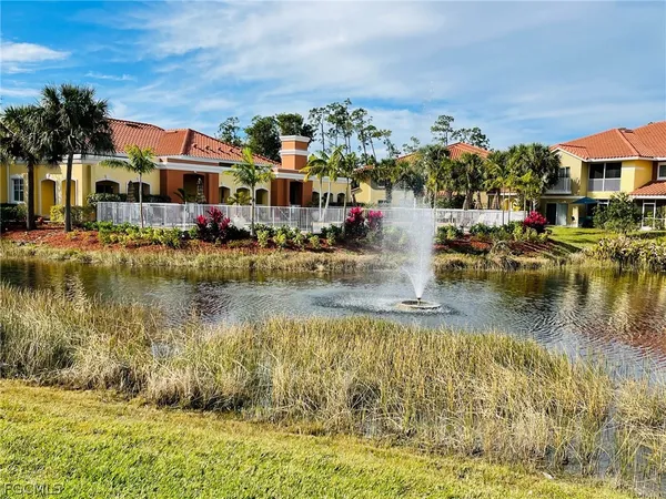 a swimming pool view with a outdoor seating