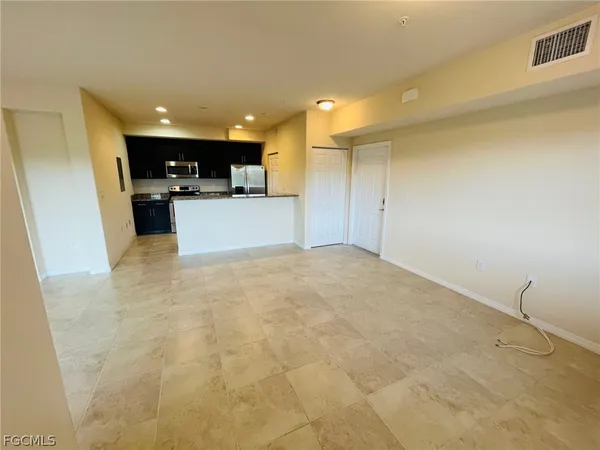 a view of kitchen with furniture and flat screen tv