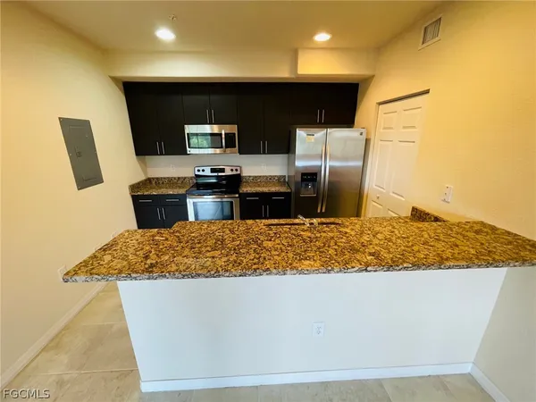a room with furniture and a flat screen tv