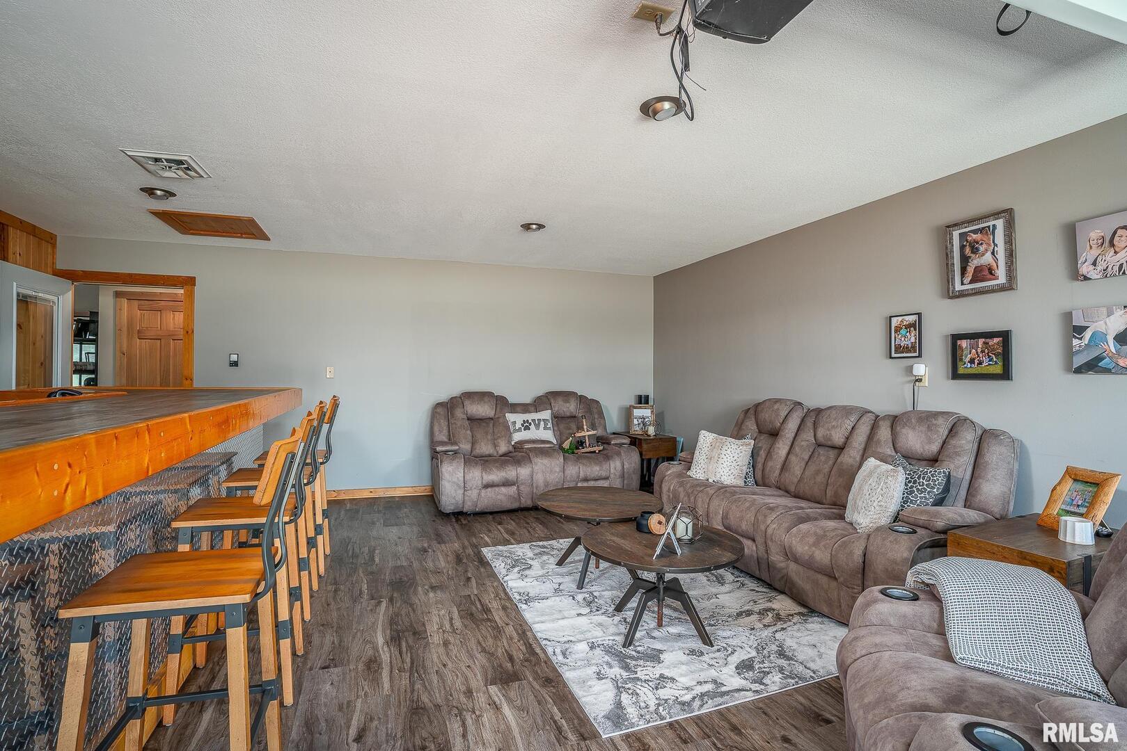 1012 Viaduct Road Savanna, IL 61074 - Photo 15 of 29 a living room with furniture a couch and wooden floor