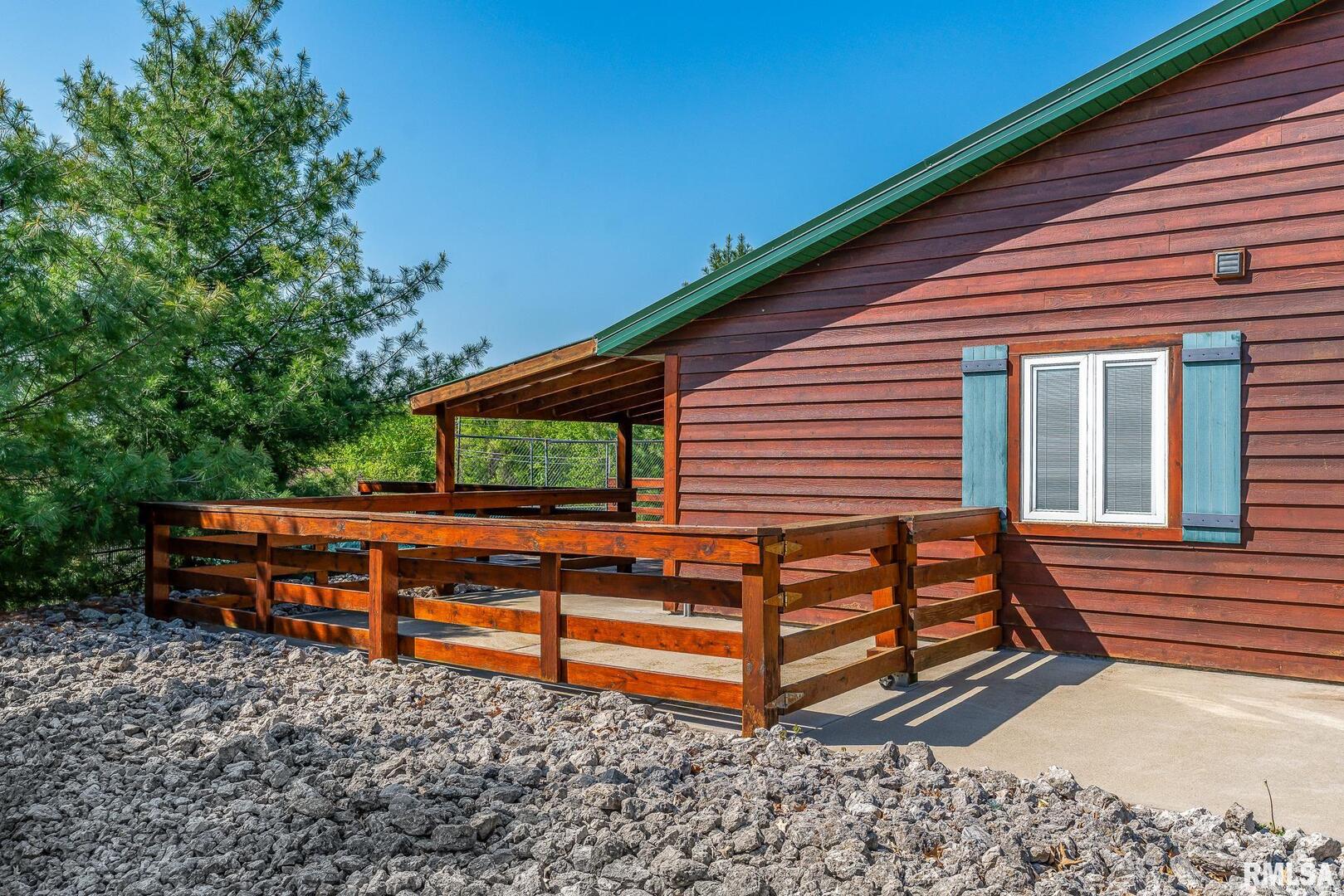 1012 Viaduct Road Savanna, IL 61074 - Photo 2 of 29 a backyard of a house with barbeque oven and wooden fence