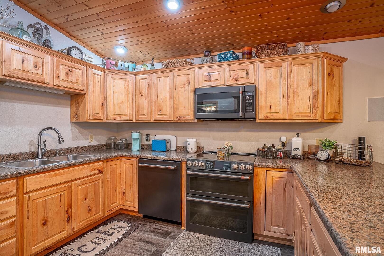 1012 Viaduct Road Savanna, IL 61074 - Photo 6 of 29 a kitchen with stainless steel appliances granite countertop a sink a stove and cabinets