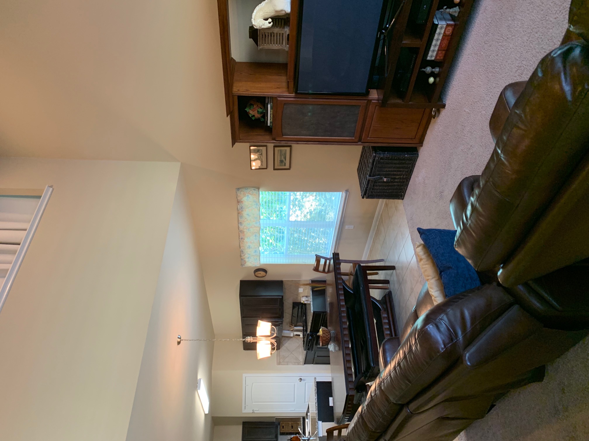 2020 Mottey Street Georgetown, TX 78626 - Photo 16 of 24 Living room with light carpet, light tile patterned flooring, and hanging lights