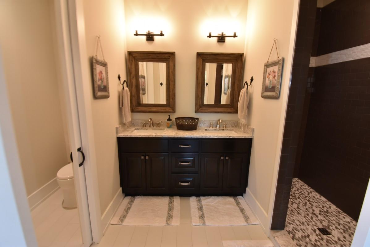 453 Matt's Way Santa Rosa Beach, FL 32459 - Photo 11 of 24 a bathroom with a sink vanity and a mirror