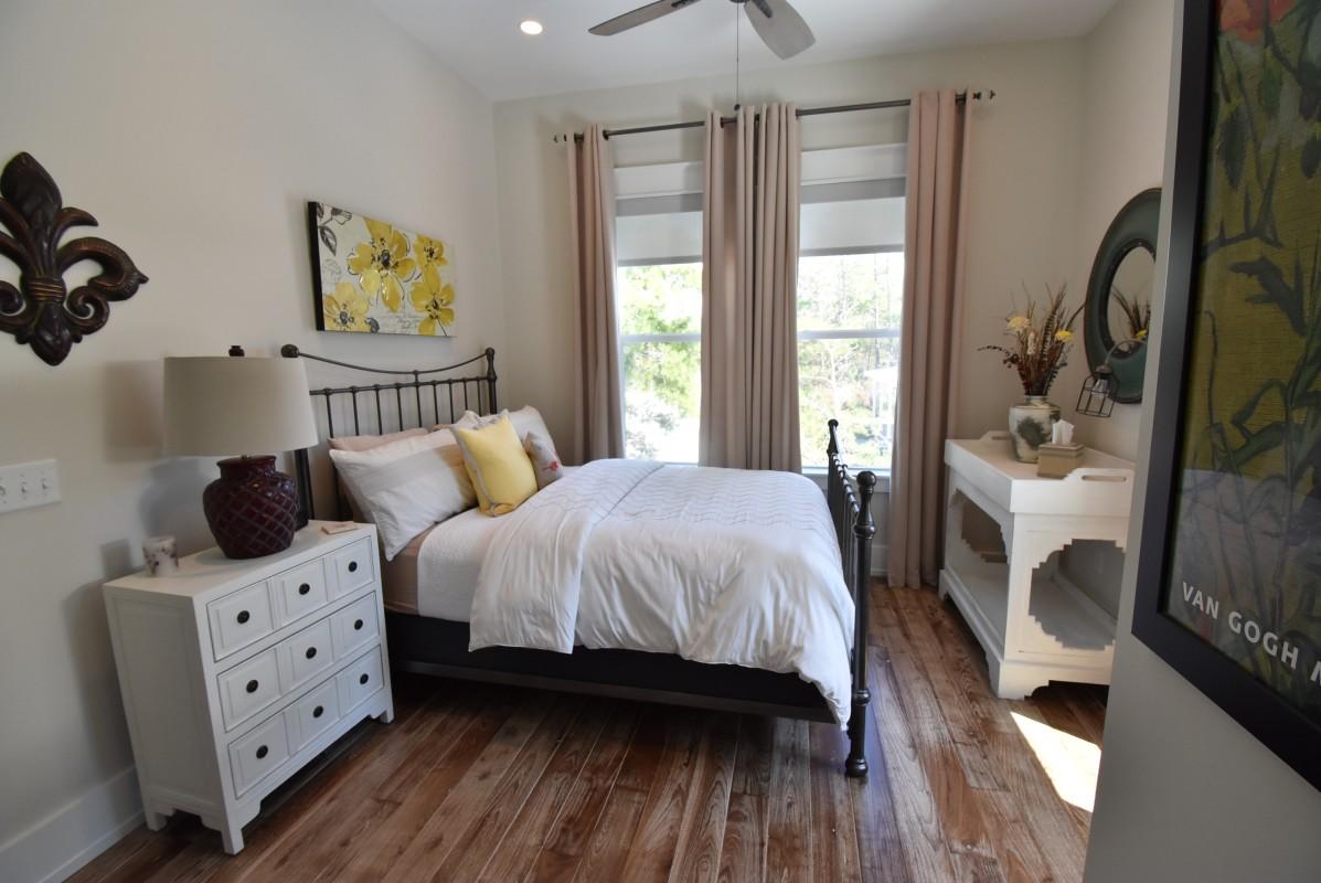 453 Matt's Way Santa Rosa Beach, FL 32459 - Photo 17 of 24 a spacious bedroom with a bed a couch and a window