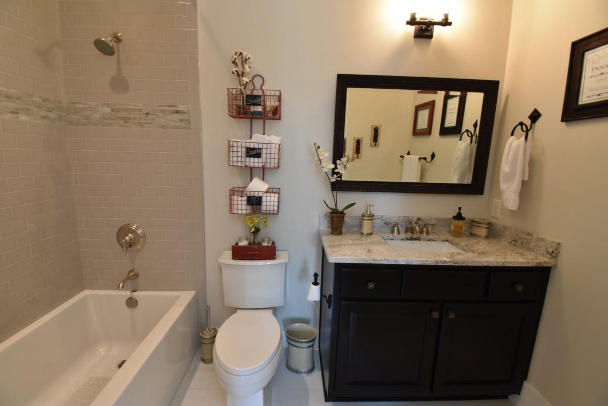 453 Matt's Way Santa Rosa Beach, FL 32459 - Photo 19 of 24 a bathroom with a granite countertop sink mirror toilet and bathtub