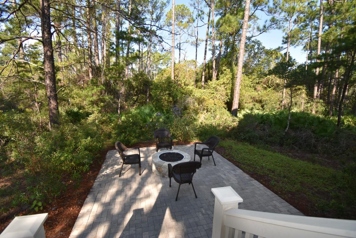 453 Matt's Way Santa Rosa Beach, FL 32459 - Photo 22 of 24 a view of a table and chairs in the garden