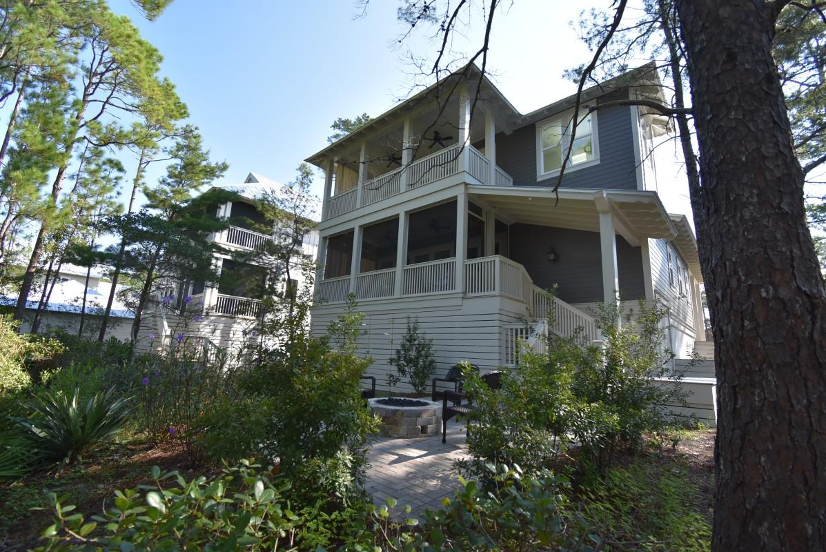 453 Matt's Way Santa Rosa Beach, FL 32459 - Photo 23 of 24 a front view of a house with a yard and potted plants