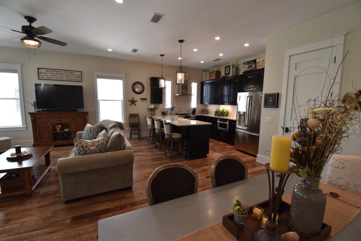 453 Matt's Way Santa Rosa Beach, FL 32459 - Photo 6 of 24 a living room with fireplace furniture and a flat screen tv
