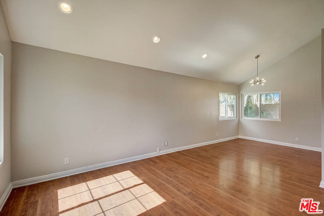 2137 Crosscreek Avenue Simi Valley, CA 93063 - Photo 12 of 31 an empty room with wooden floor and windows