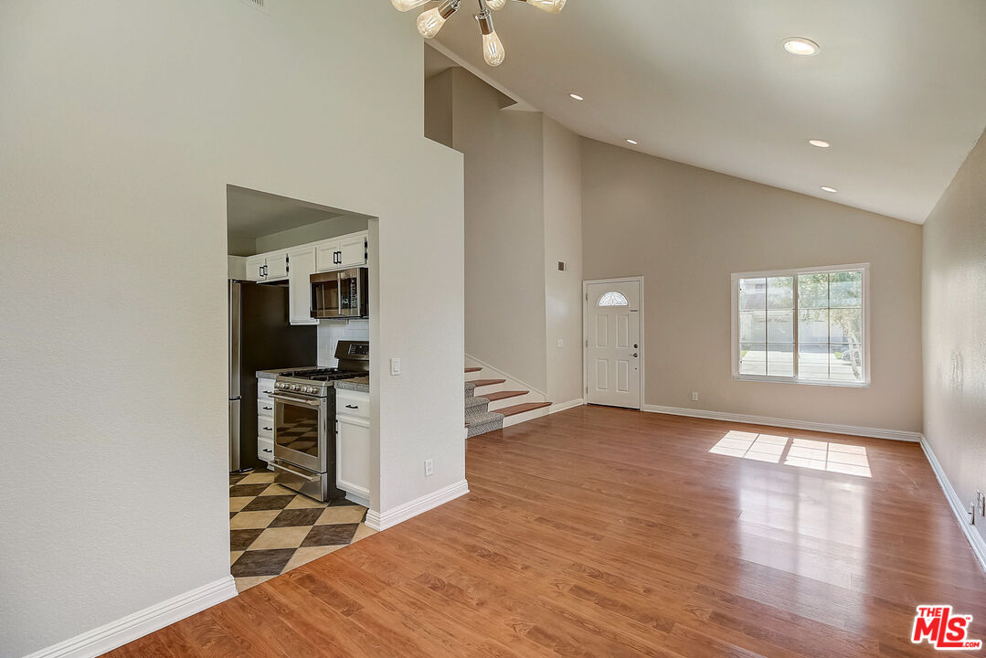 2137 Crosscreek Avenue Simi Valley, CA 93063 - Photo 13 of 31 a view of a kitchen with wooden floor and a kitchen