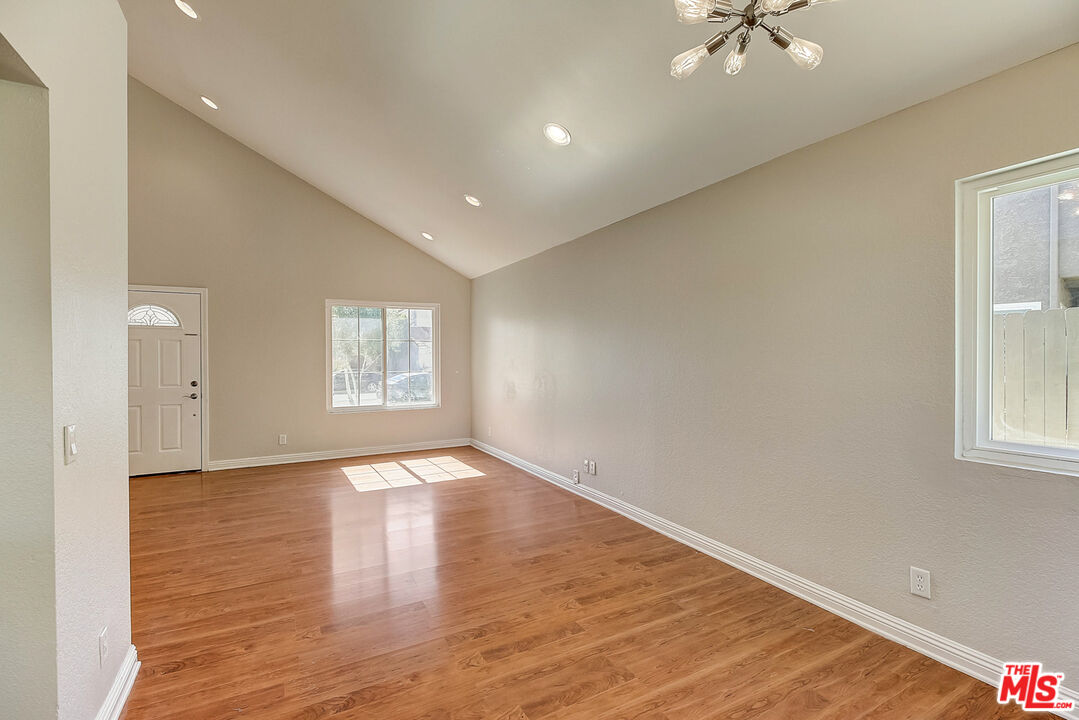 2137 Crosscreek Avenue Simi Valley, CA 93063 - Photo 14 of 31 wooden floor in an empty room with a window