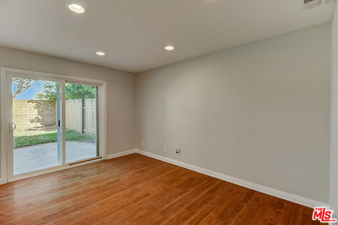2137 Crosscreek Avenue Simi Valley, CA 93063 - Photo 16 of 31 an empty room with wooden floor and windows