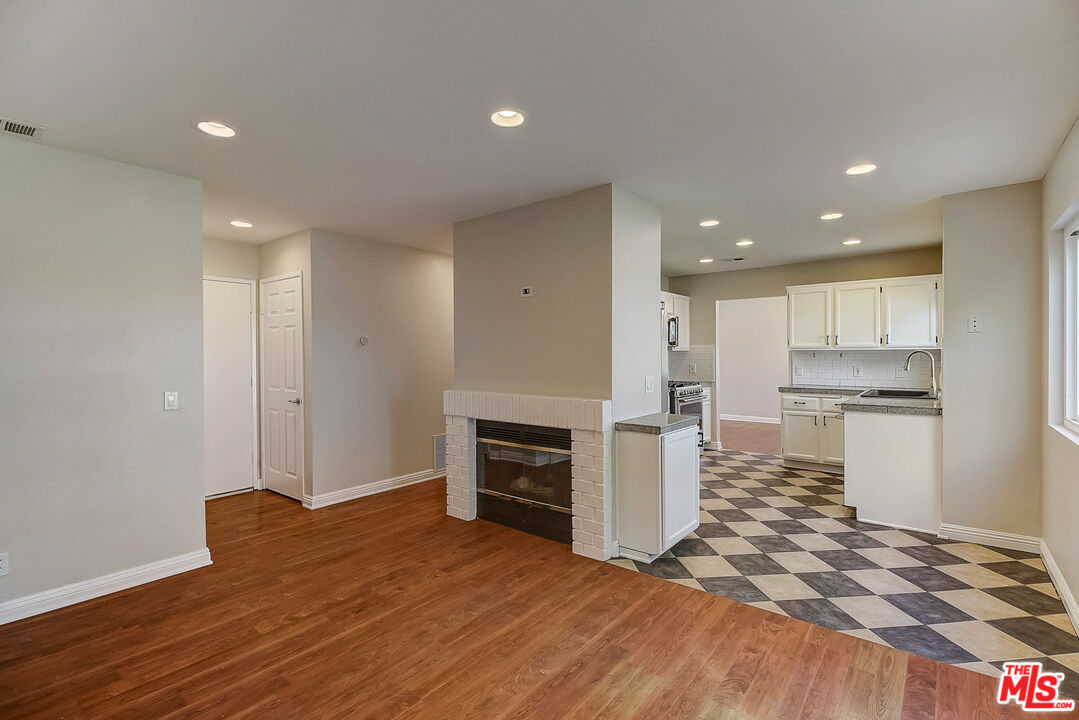 2137 Crosscreek Avenue Simi Valley, CA 93063 - Photo 17 of 31 a open kitchen with white cabinets and stainless steel appliances