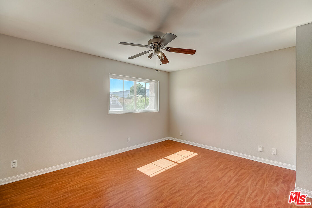 2137 Crosscreek Avenue Simi Valley, CA 93063 - Photo 19 of 31 wooden floor in an empty room with a window