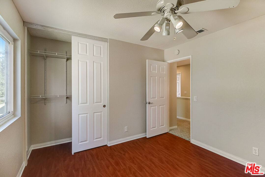 2137 Crosscreek Avenue Simi Valley, CA 93063 - Photo 27 of 31 a view of an empty room with wooden floor and window