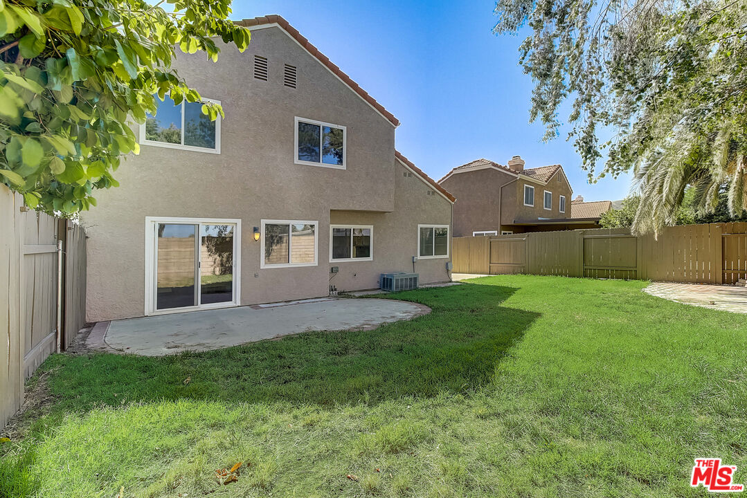 2137 Crosscreek Avenue Simi Valley, CA 93063 - Photo 29 of 31 a view of a yard in front of a house with large tree