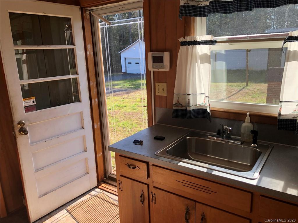 4701 Old Hickory Road Lancaster, SC 29720 - Photo 2 of 24 a kitchen sink sitting next to a window