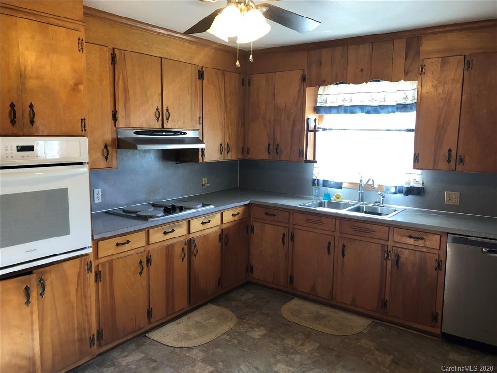 4701 Old Hickory Road Lancaster, SC 29720 - Photo 5 of 24 a kitchen with stainless steel appliances granite countertop a sink a stove and cabinets