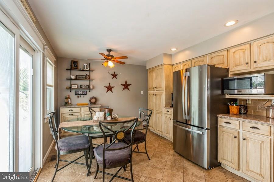1008 London Circle Williamstown, NJ 08094 - Photo 7 of 25 a kitchen with stainless steel appliances a refrigerator and a table