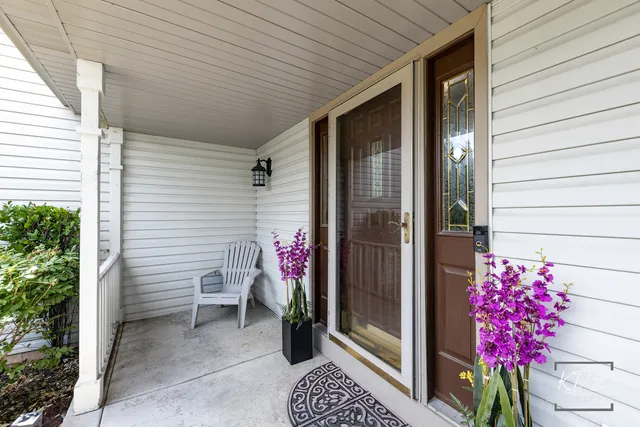 a view of a porch with flowers