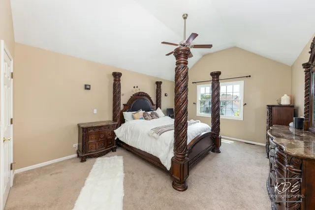 a bedroom with a bed and a table