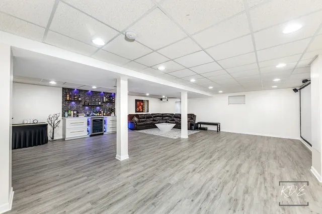 a view of a room with wooden floor