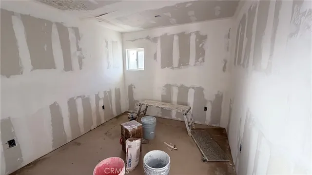 a bedroom with furniture and wooden floor