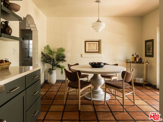 a kitchen with granite countertop a stove and a sink