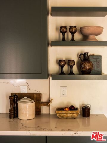 a bedroom with two beds and a lamp