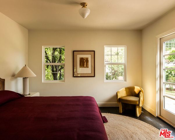 a bathroom with a sink a mirror and shower